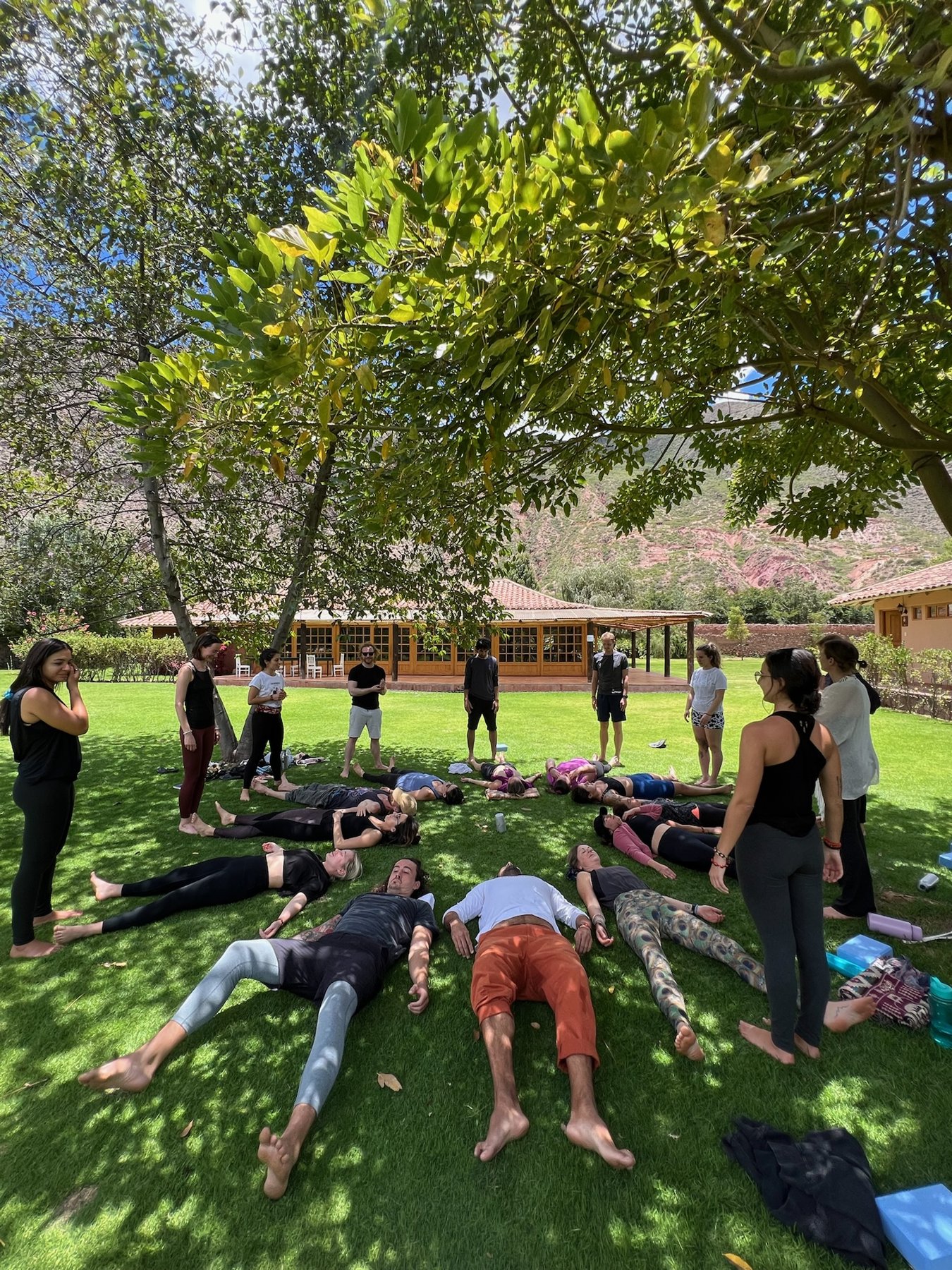 Residents sharing a practice session on the grass beneath the trees