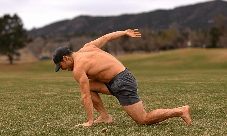Grant Thomas moving low across a grass field