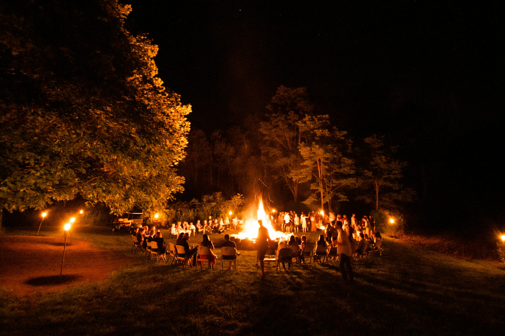 Innate community gathered around a bonfire at night