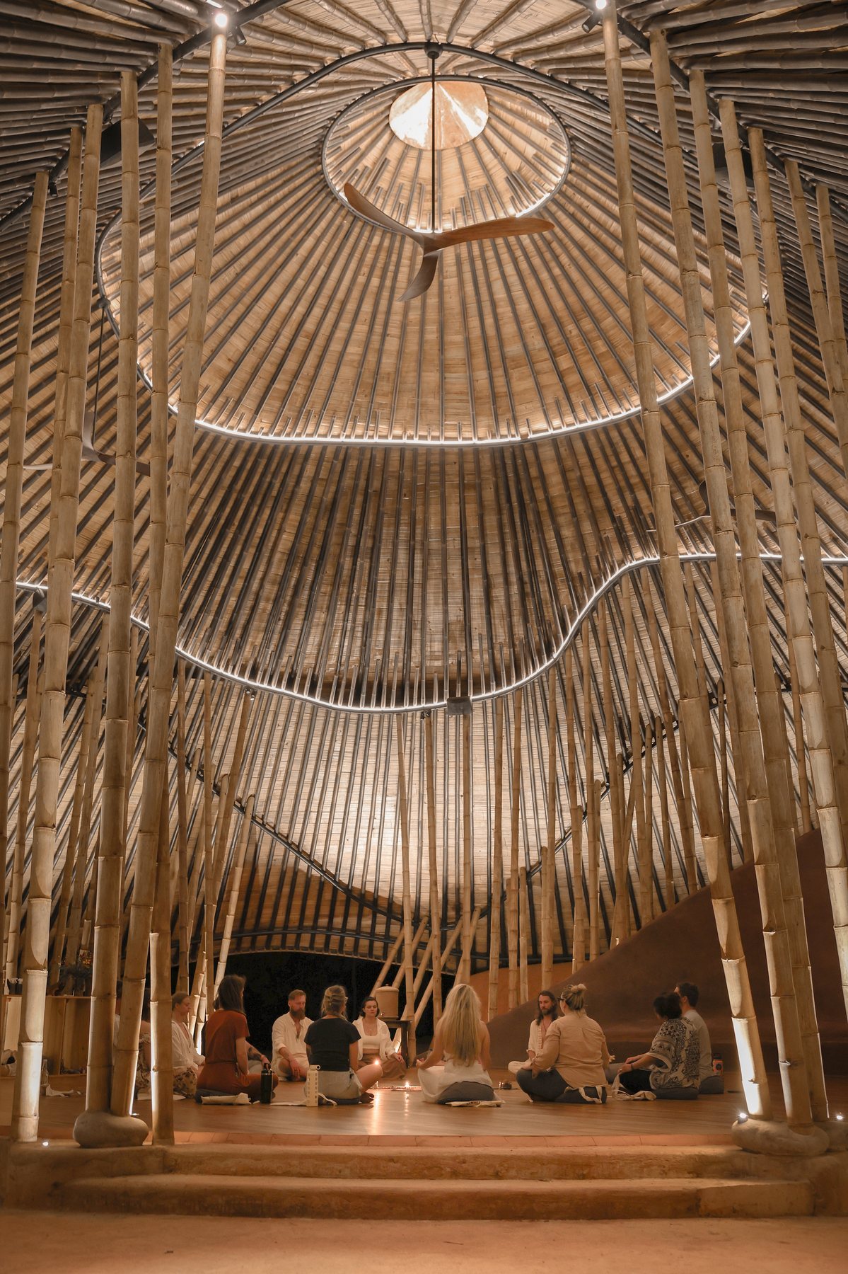 A circle gathering inside Tierramor's giant bamboo maloca